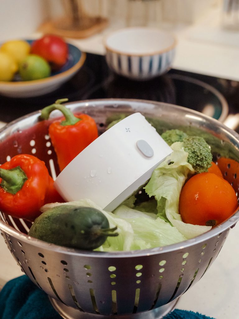 pesticide cleaner in colander with vegetables