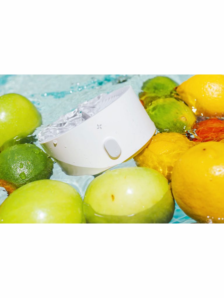 pesticide cleaner in water with citrus fruit and apples