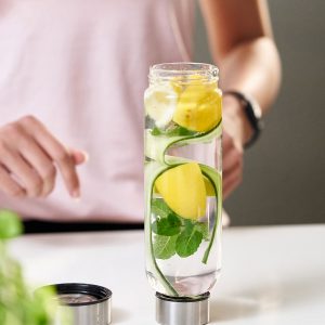 Bo-Bottle drinking bottle upside down without bottom, with water, cucumber, mint, lemon