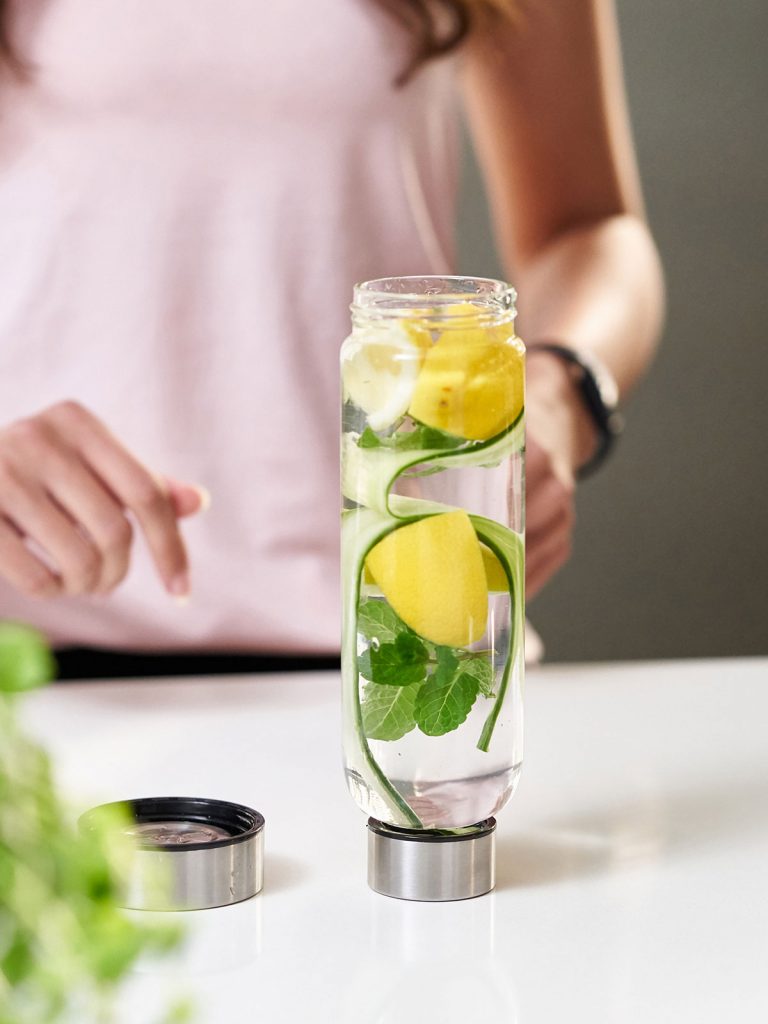 Bo-Bottle drinking bottle upside down without bottom, with water, cucumber, mint, lemon